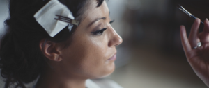 woman getting her wedding makeup done