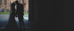 Couple in archway at castle